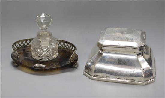 A silver mounted inkwell and a silver mounted inkstand with glass bottle and stopper.